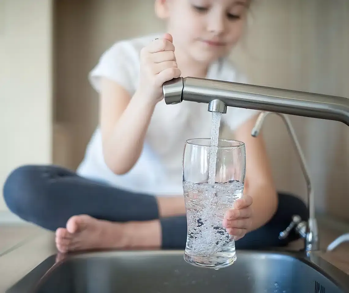 water test kit-child filling a glass with safe drinking water water test kit-child filling a glass with safe drinking water