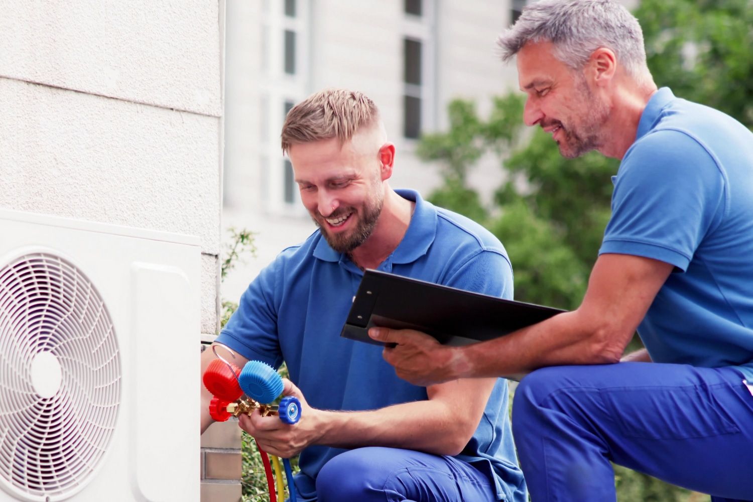 technicians are inspecting a HVAC unit technicians are inspecting a HVAC unit