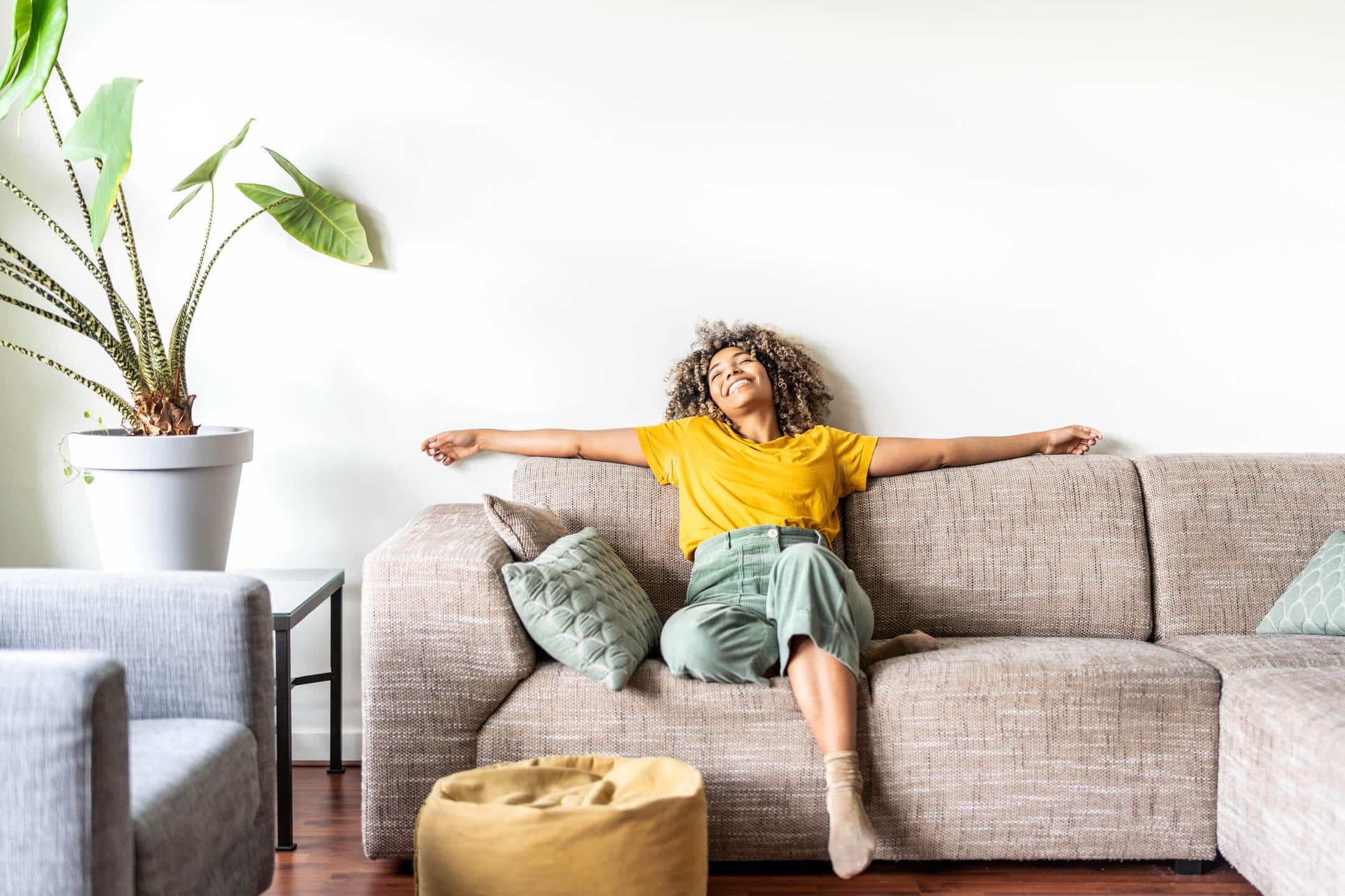 how does ac work-woman sitting on her couch enjoying the ac how does ac work-woman sitting on her couch enjoying the ac