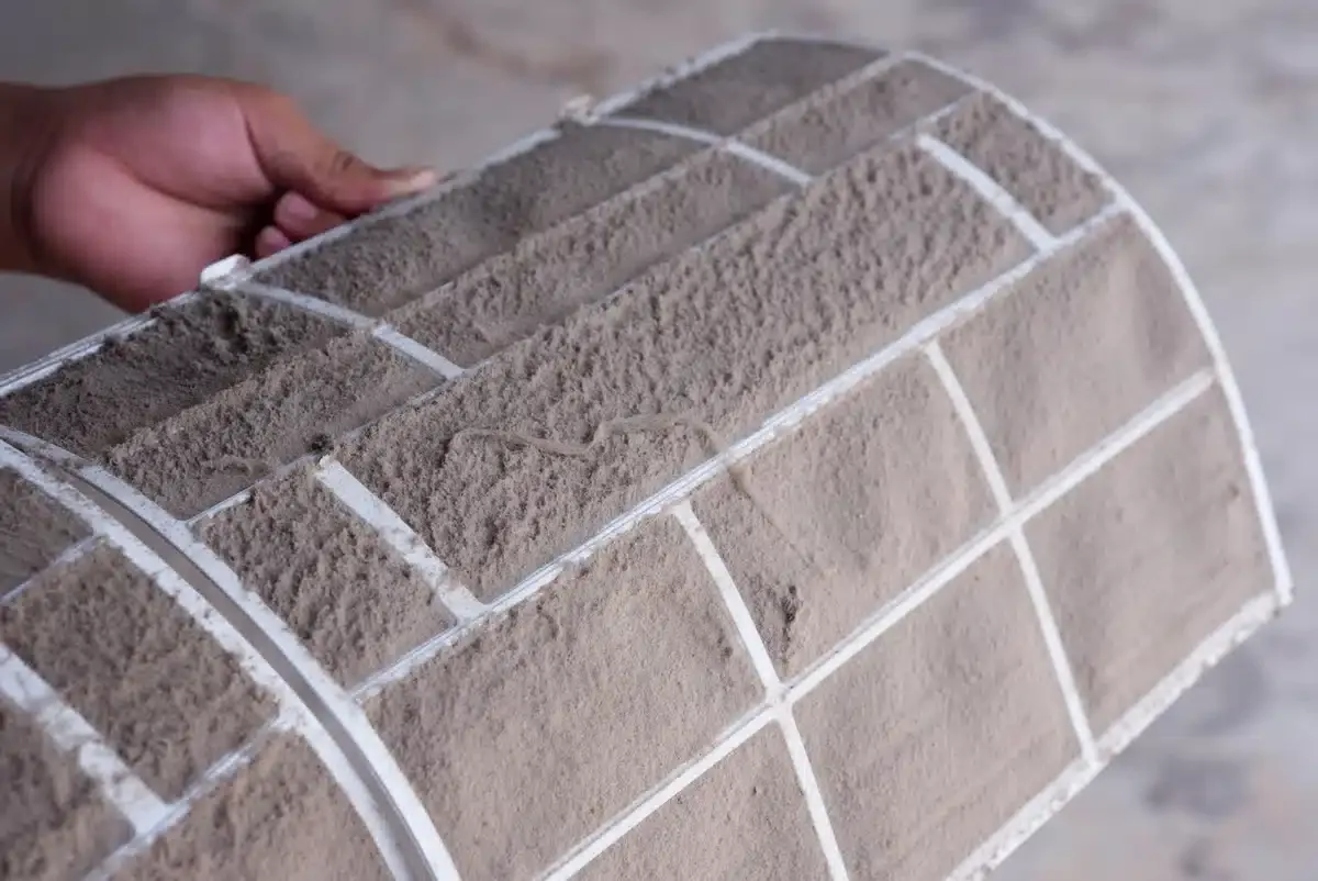 how often to change furnace filter-close up of very dirty furnace filter how often to change furnace filter-close up of very dirty furnace filter
