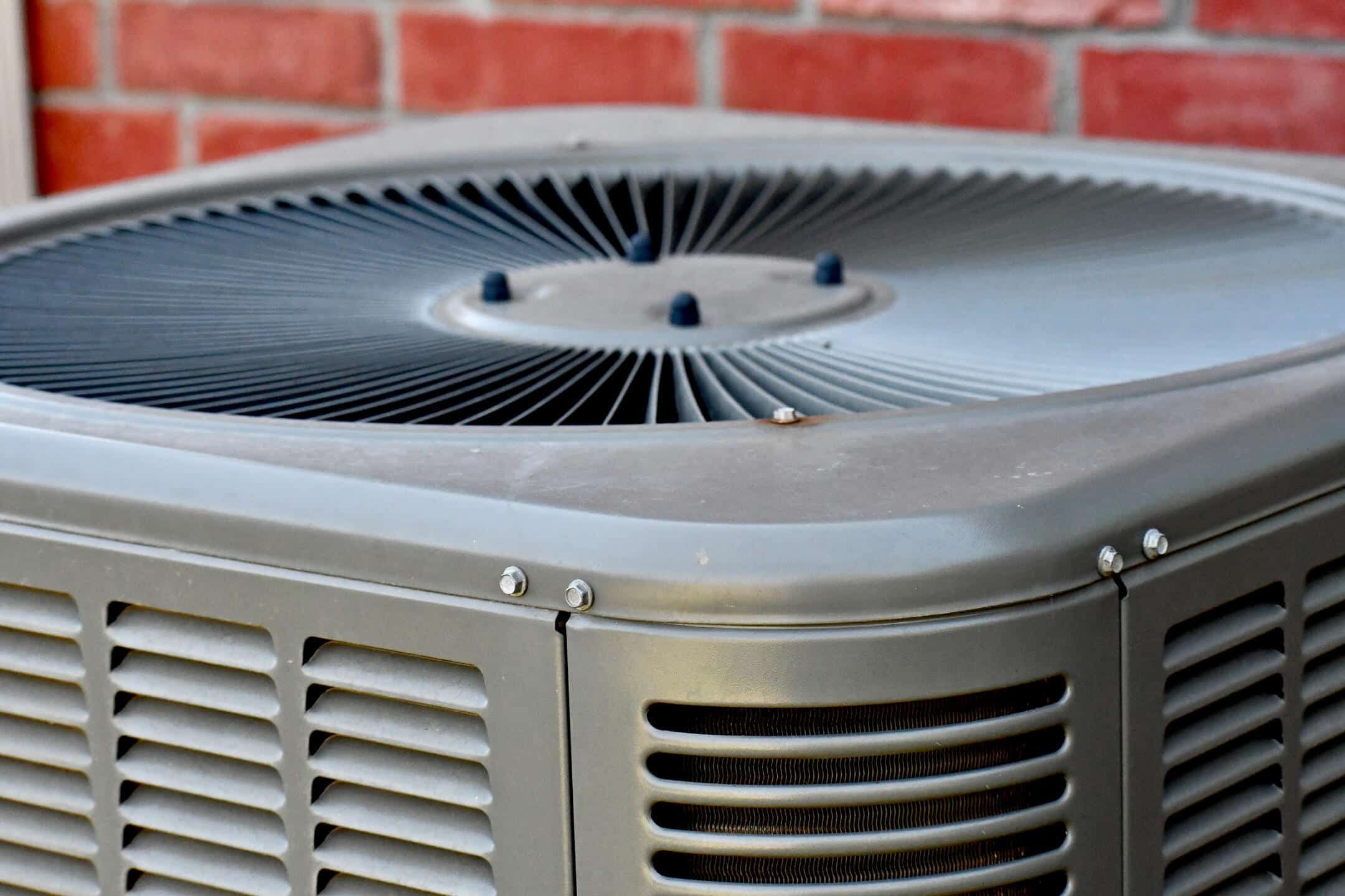 ac unit cost-close up image of a new AC unit next to a brick house ac unit cost-close up image of a new AC unit next to a brick house
