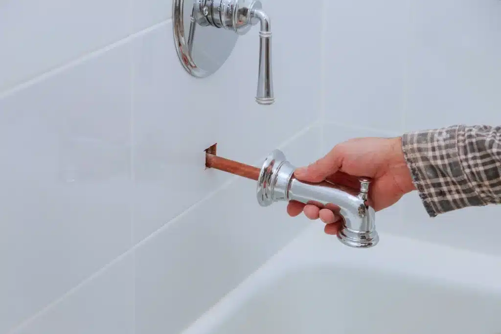 bathtub faucet being replaced