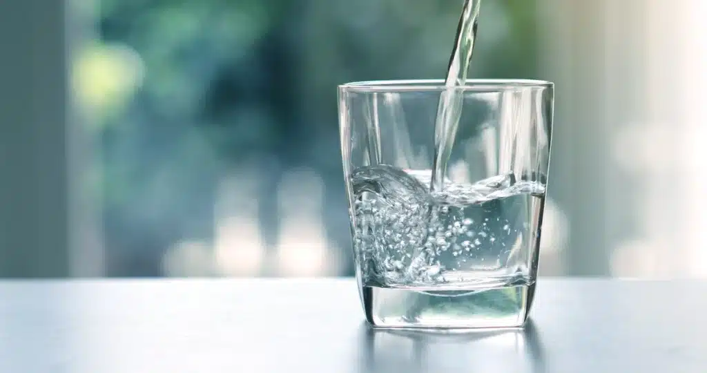 glass being filled with water.