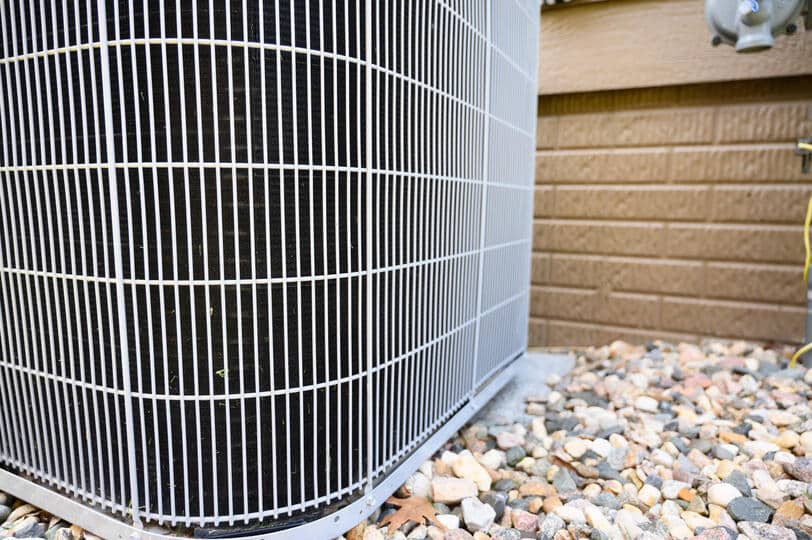 ac coil cleaner-close up of ac unit with debris-free coils