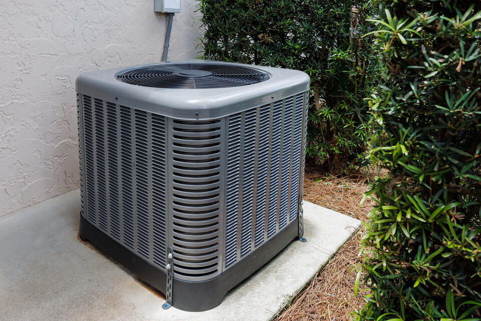 ac not turning on-outdoor ac unit near house and shrubbery