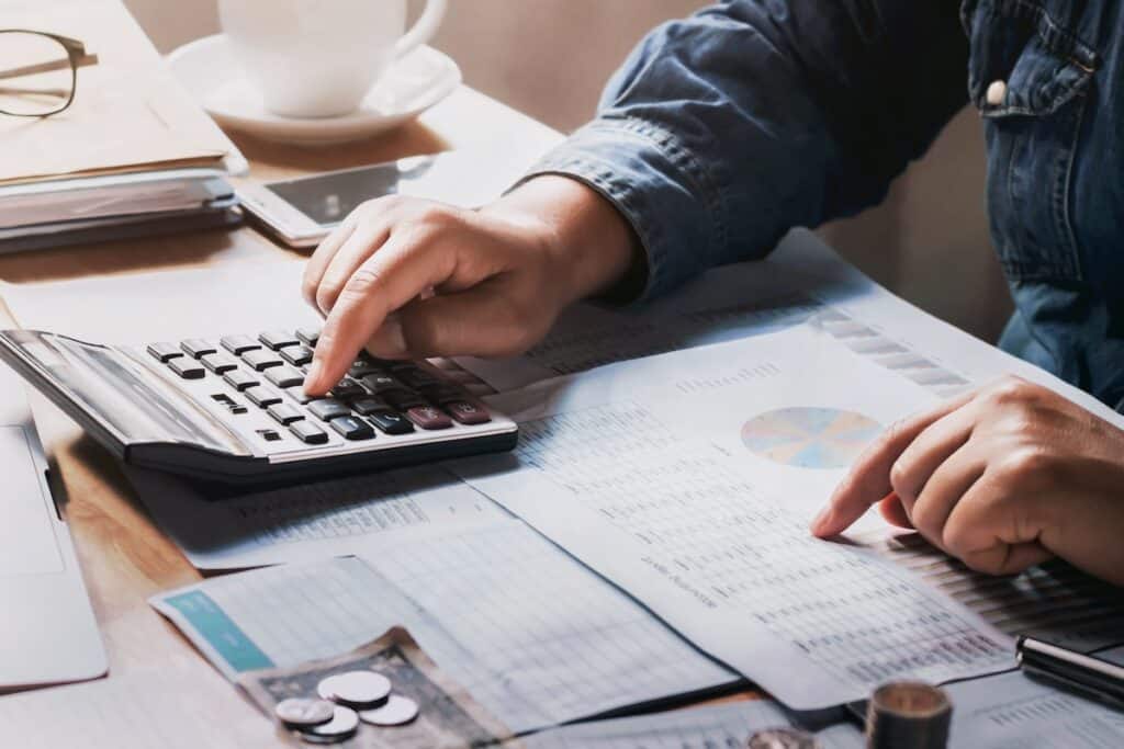 person calculating hvac finances