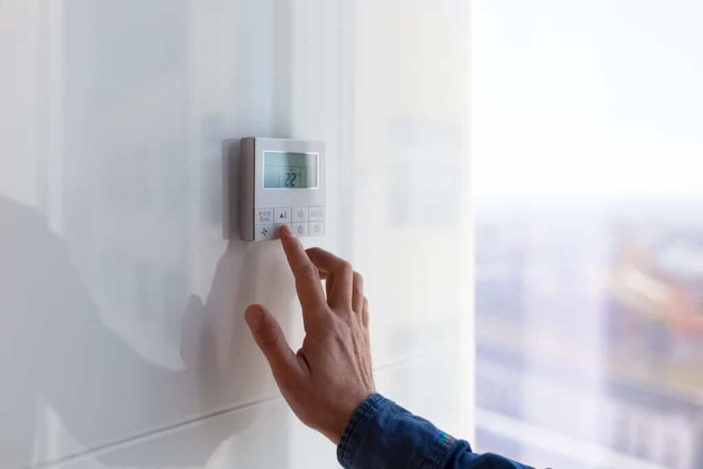 recommended thermostat settings for summer The air conditioning and heating control panel for the apartment and office is located on a white wall